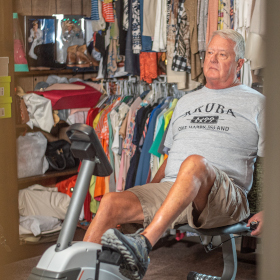 Jim, knee replacement patient using exercise equipment