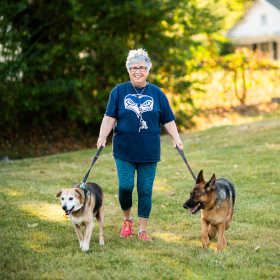 nancy heffernan, full body, happily walking her dogs