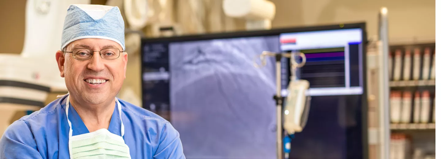 Ballad Health surgeon smiling in operating scrubs and cap