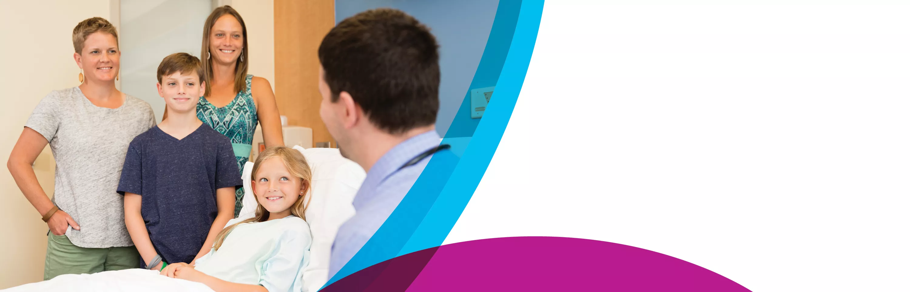 Mother and two children speaking with doctor at hospital bedside of smiling daughter/sibling